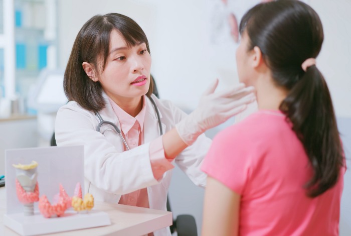 Doctor Checking a female’s Thyroid Nodules