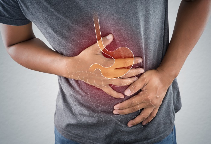 Man Suffering from Digestive issues - Advanced Functional Medicine