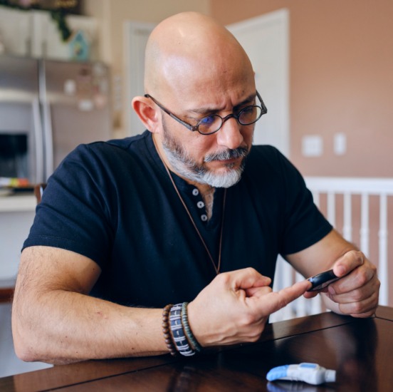 Type 2 Diabetic testing his sugar - Advanced Functional Medicine